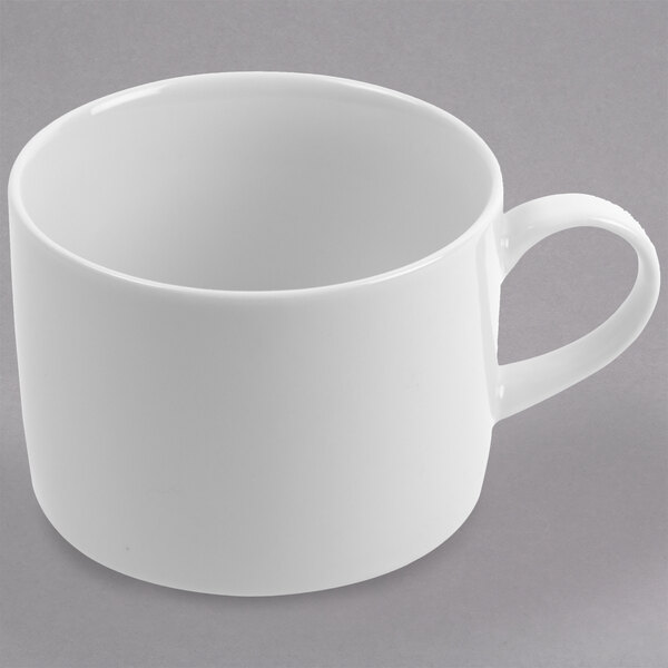 A 10 Strawberry Street Royal White porcelain can cup with a handle.