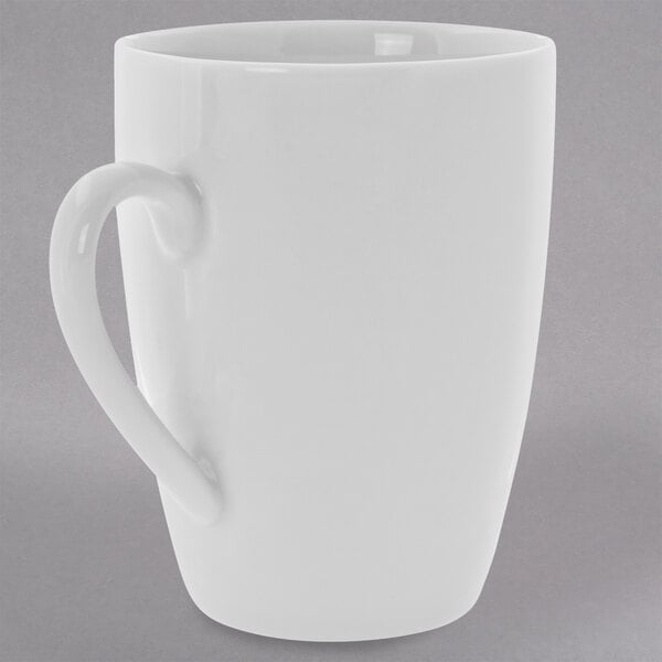 A 10 Strawberry Street Royal White porcelain barrel mug with a handle.