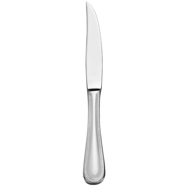A close up of a Libbey stainless steel steak knife with a white background.
