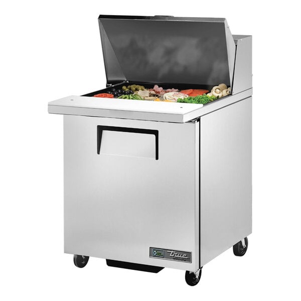 A True stainless steel refrigerated sandwich prep table with a large compartment for food pans.
