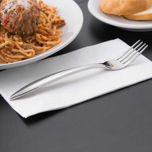 A Libbey stainless steel dinner fork on a plate of spaghetti