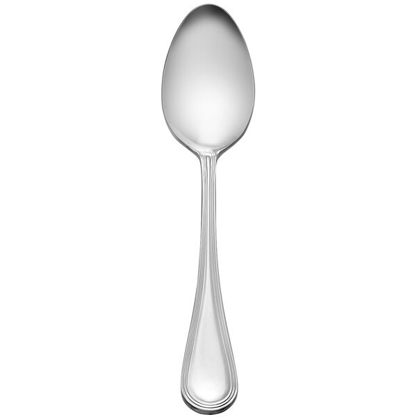 A Libbey stainless steel serving spoon with a round handle on a white background.