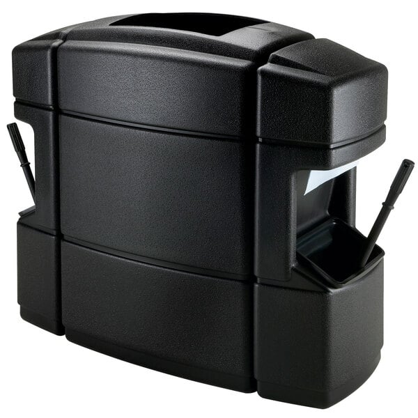 A black rectangular Commercial Zone waste container with paper towels and squeegees inside.
