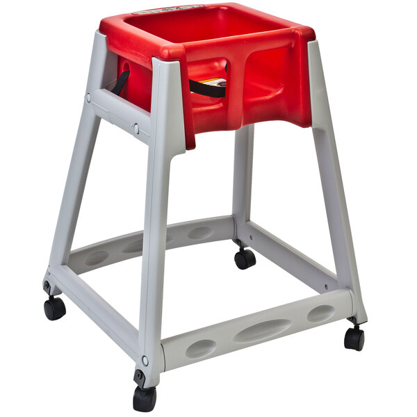 A grey and red Koala Kare baby high chair with wheels.