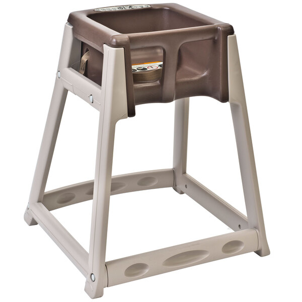 A beige plastic Koala Kare high chair with a brown plastic tray on the seat.
