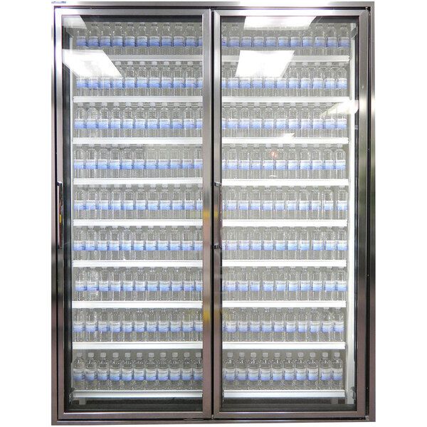 A Styleline walk-in freezer glass door with shelving holding bottles of water.