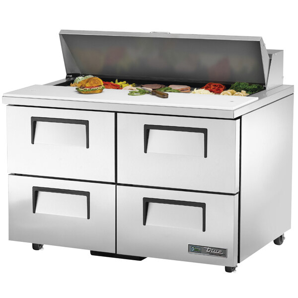 A white True refrigerated sandwich prep table with four drawers and a door.
