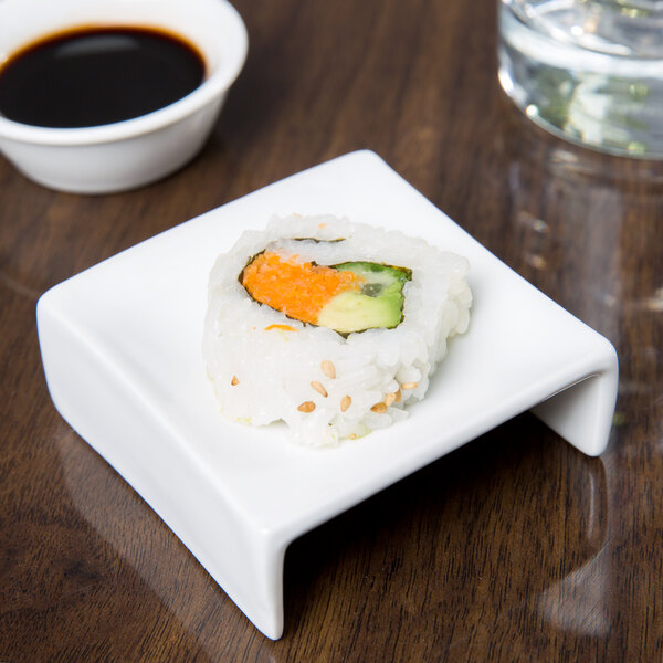 A sushi roll on a Libbey ultra bright white porcelain elevated plate.