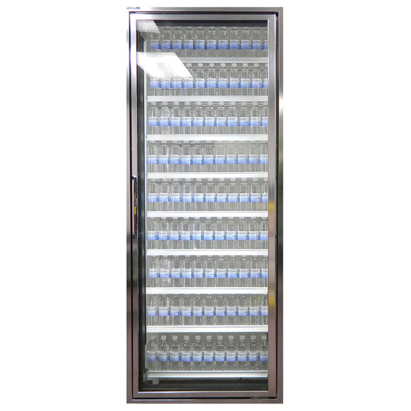 A Styleline Classic Plus walk-in freezer door with shelving and a row of small bottles with blue labels inside.