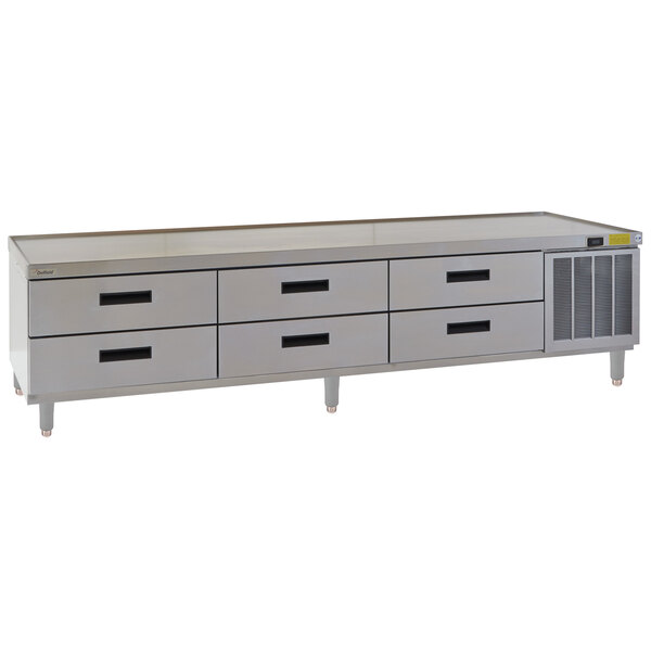 A stainless steel Delfield chef base with drawers.