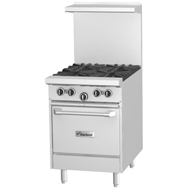 A white Garland commercial gas range with a space saver oven.