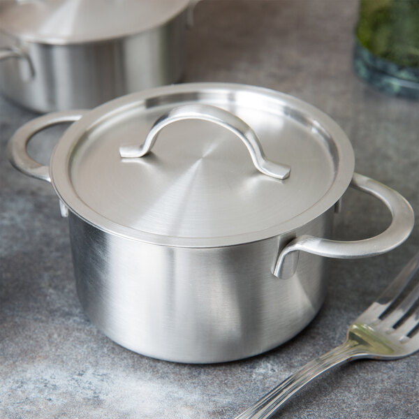 A stainless steel Clipper Mill mini serving pot with a lid.