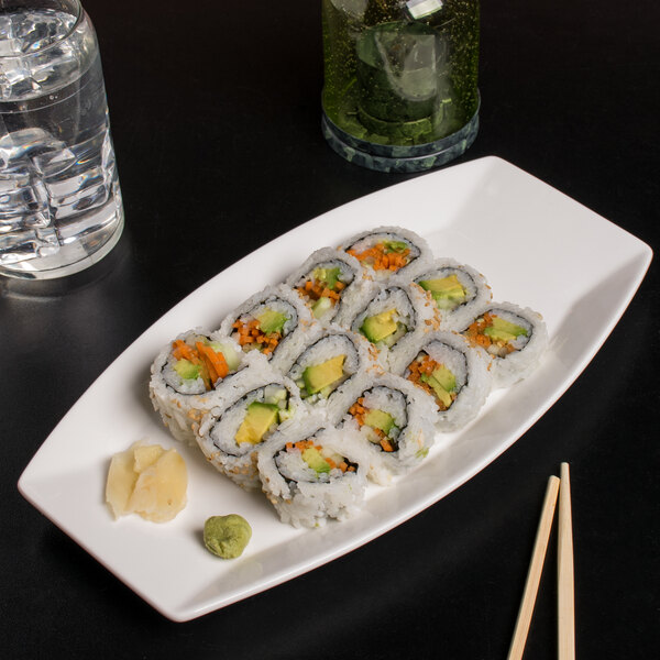 A rectangular white porcelain Libbey serving tray with sushi rolls on it.