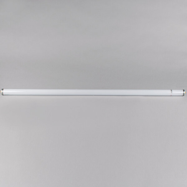 A Satco 48" shatterproof cool white fluorescent light bulb on a white surface.