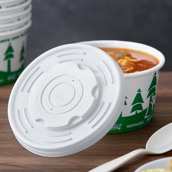 A white EcoChoice PLA plastic lid on a container of soup.