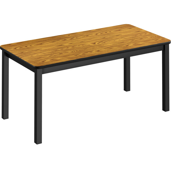 A Correll library table with a wooden top and black legs.