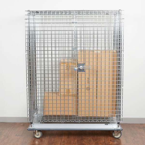 A Metro chrome wire security cabinet on wheels with boxes inside.