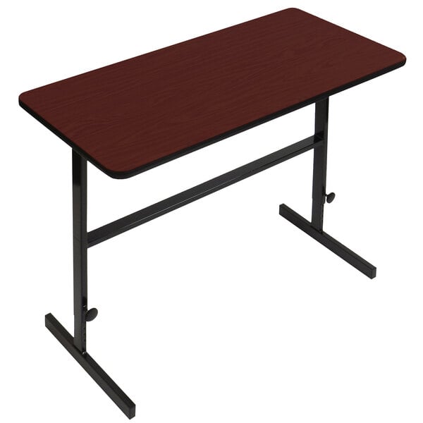 A brown rectangular table with black metal legs and a red top.