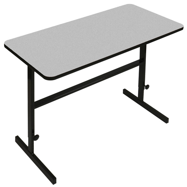 A white rectangular table with a gray granite top and black frame.