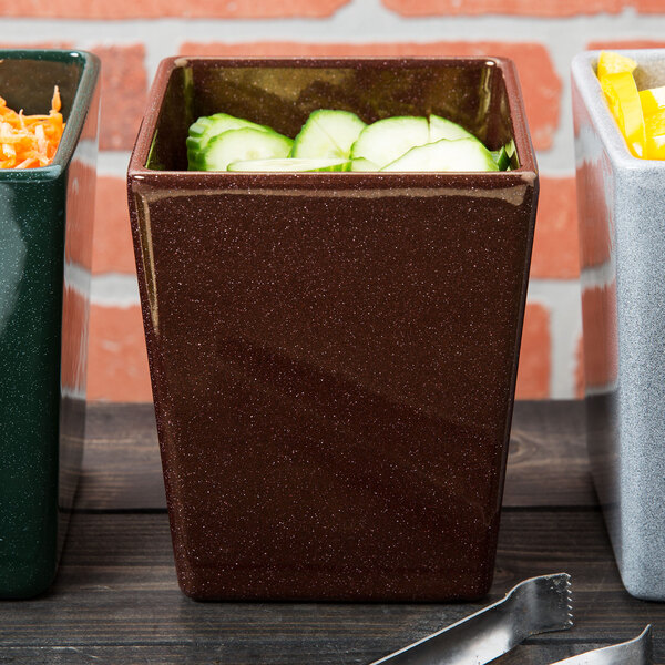 A group of Tablecraft maroon speckle square containers with vegetables inside.