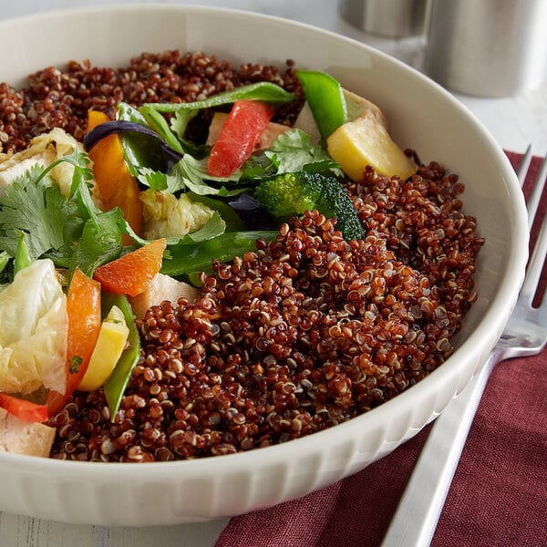 A bowl of red quinoa and vegetables.