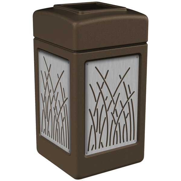 A brown rectangular trash receptacle with stainless steel reed panels.