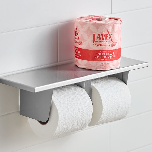 A Lavex standard toilet paper roll on a metal shelf.