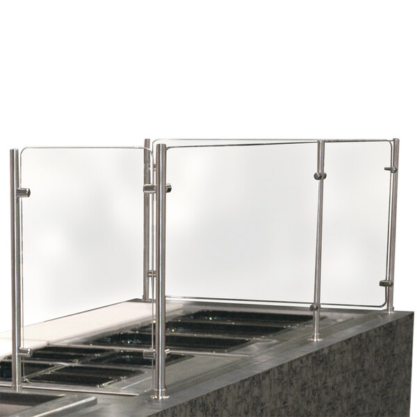 A stainless steel counter top with an Advance Tabco glass sneeze guard.