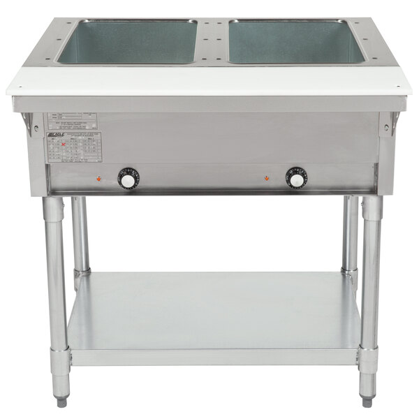 An Eagle Group stainless steel open well electric hot food table with two rectangular sinks.