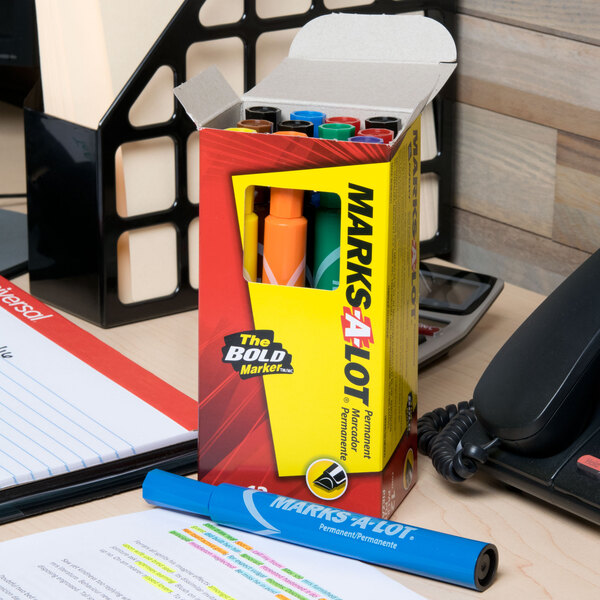 A box of Avery Marks-A-Lot permanent markers on a desk.