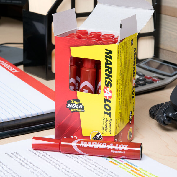 A box of Avery Marks-A-Lot red permanent markers on a desk.