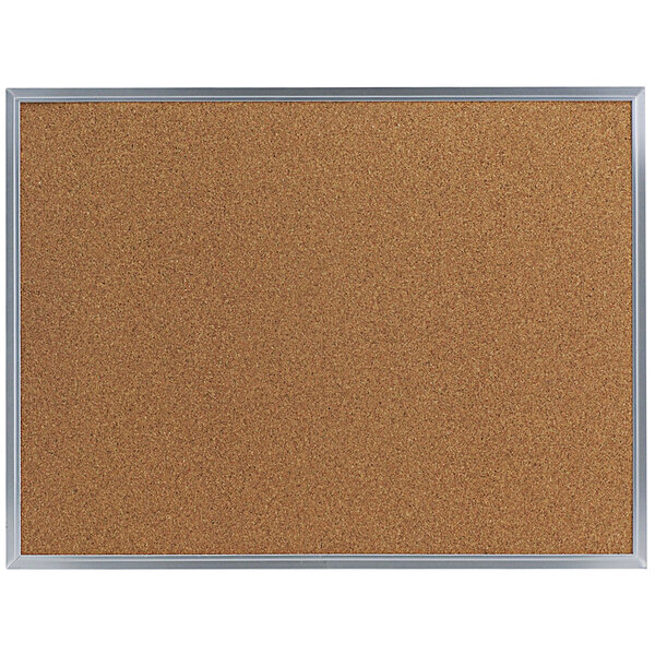 A Universal cork board with a silver frame.