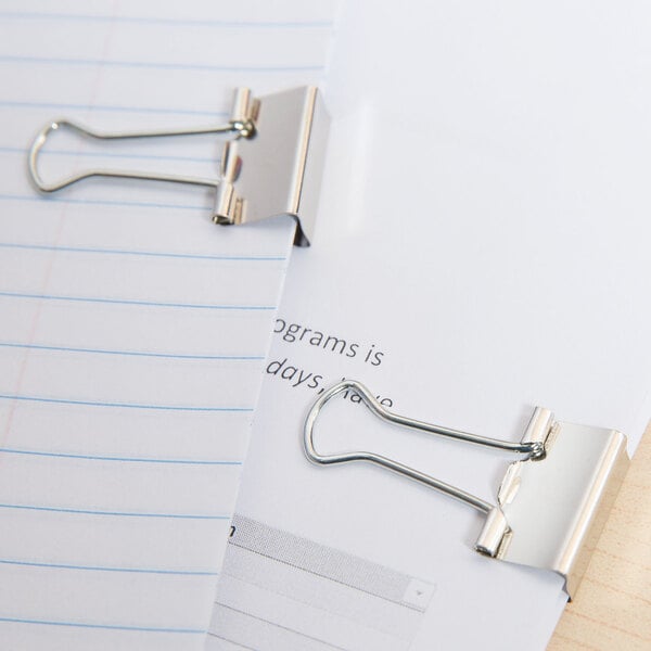 A paper with Universal small binder clips and paper clips on it.