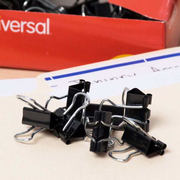A box of Universal black mini binder clips.