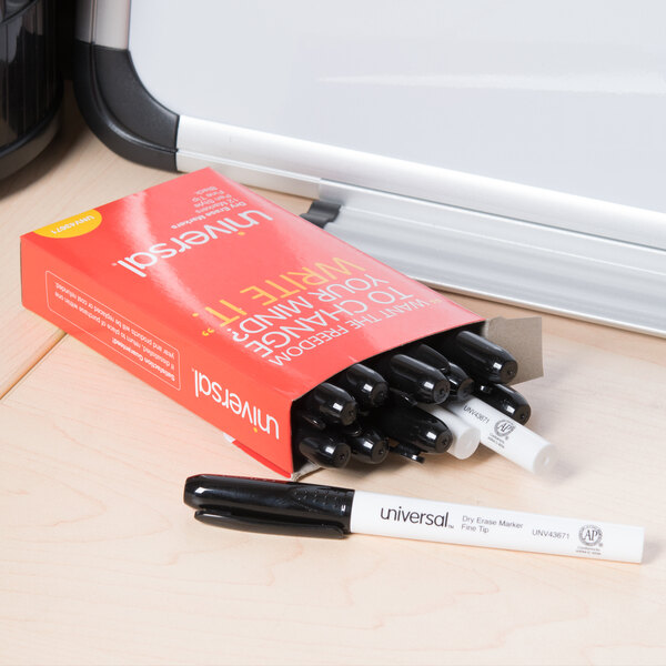 A red box of Universal black dry erase markers on a white table.