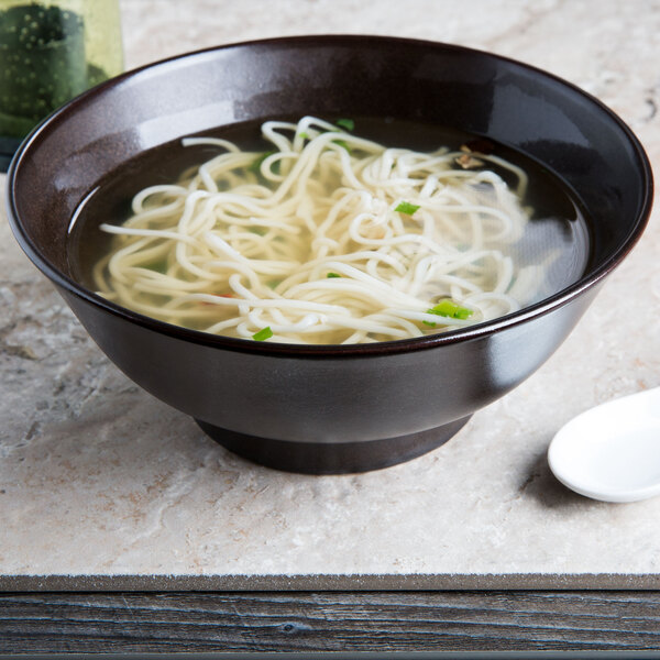 A Tuxton Lava China ramen bowl filled with noodles in broth.