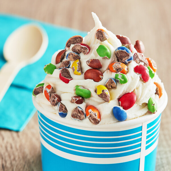 A cup of Chopped Cocoa Gems ice cream with candy on top.