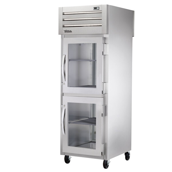 A silver True Spec Series pass-through refrigerator with half glass doors.