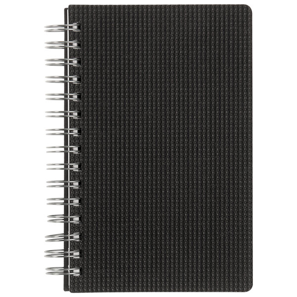 A close-up of a Black Brownline DuraFlex spiral notebook with metal rings.