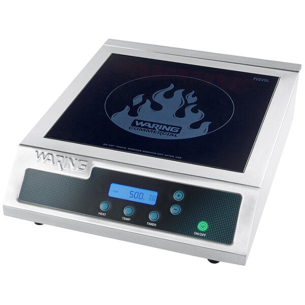 A silver square Waring induction range on a counter.