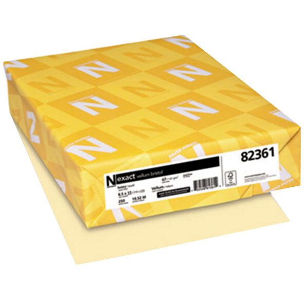 A yellow box with white letters and a white label that reads "Neenah Exact Vellum Paper Cover Stock"