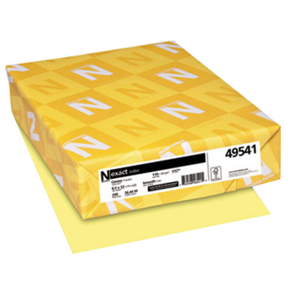 A yellow box of Neenah Exact Canary cardstock with white and yellow labels.