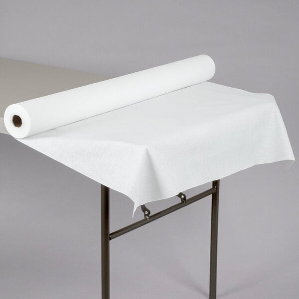 A Hoffmaster white linen-like paper roll on a table.