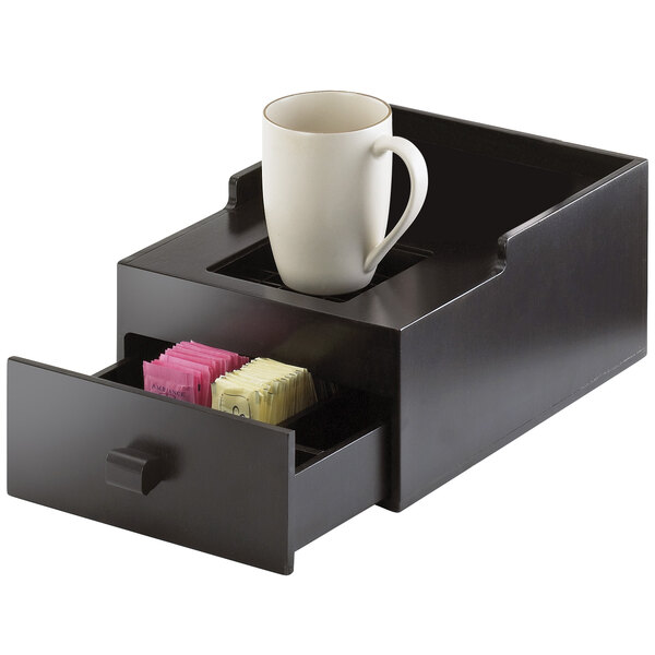 A Cal-Mil midnight bamboo airpot stand with a white mug on the drawer.