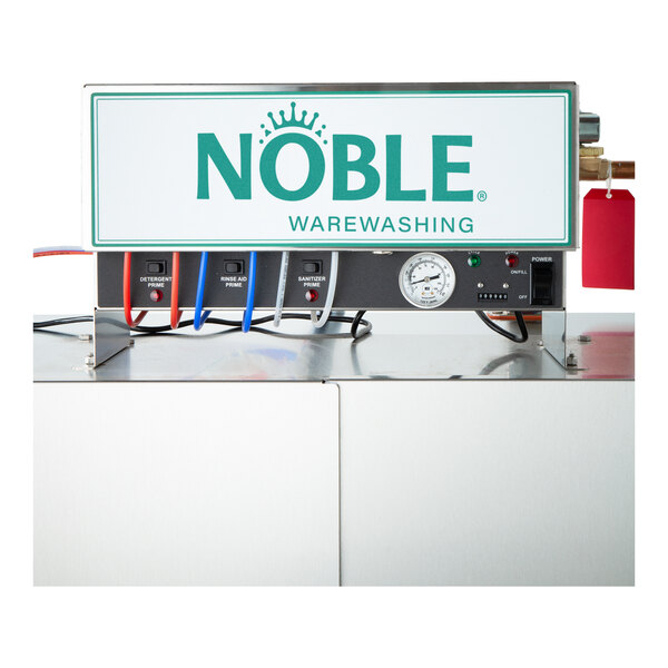 A commercial Noble Warewashing double rack low temperature corner dishwasher with control panel and labeled hoses.
