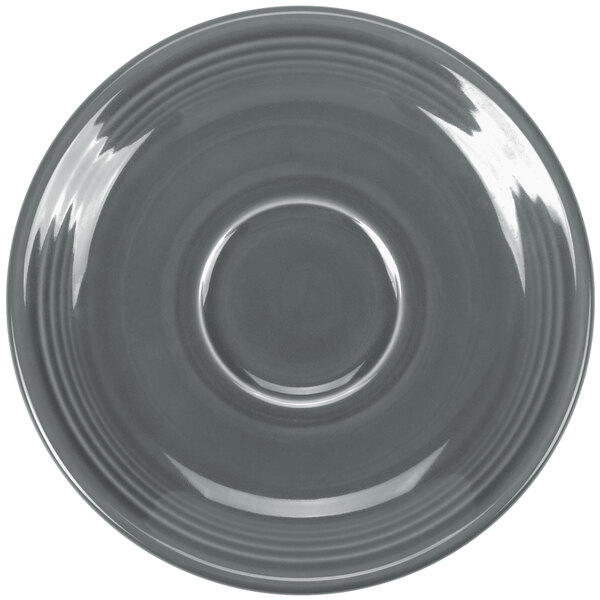 A close-up of a shiny gray Fiesta saucer with a circular pattern on the rim.