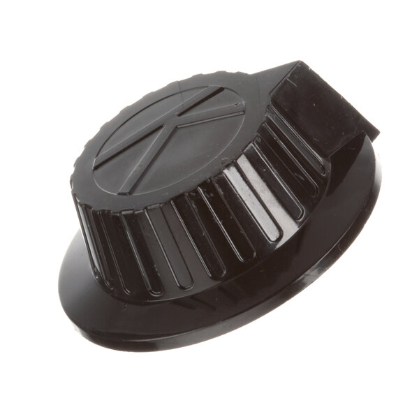 A black plastic Keating thermostat knob with an X on it.