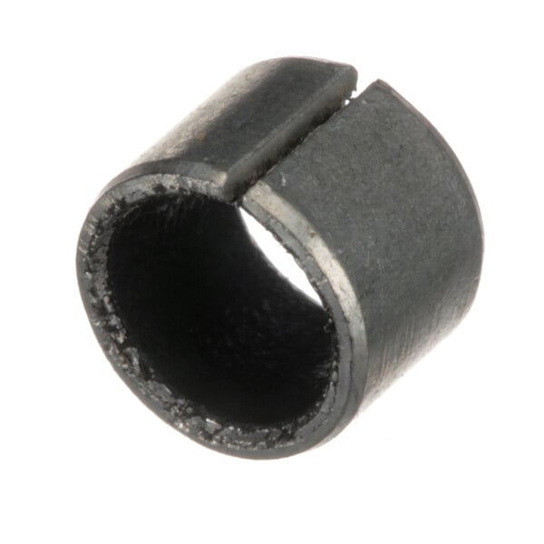 A close-up of a black metal Berkel bushing with a hole in it.