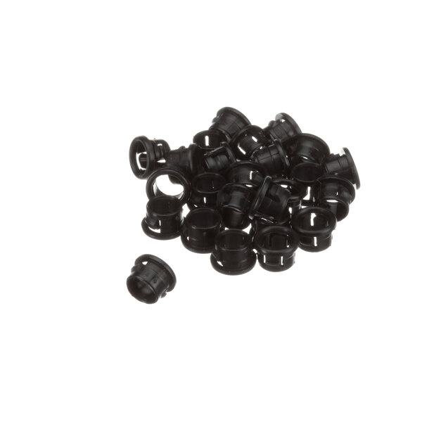 A pile of black plastic bushings with a round base.