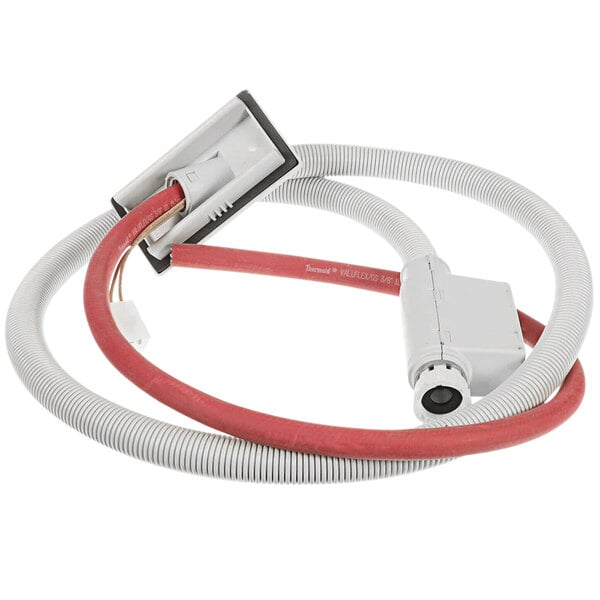 A white and red cable with a red connector attached to a Meiko Aquastop.